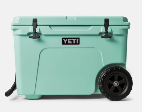 YETI Tundra Haul wheeled cooler in seafoam green with black wheels